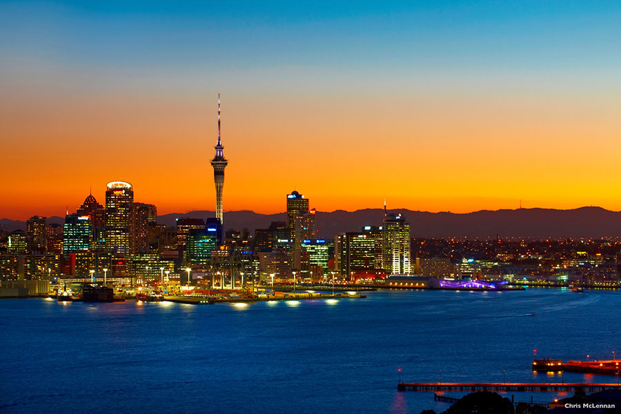 View of Auckland City and Harbour at dusk. Copyright: Chris McLennan