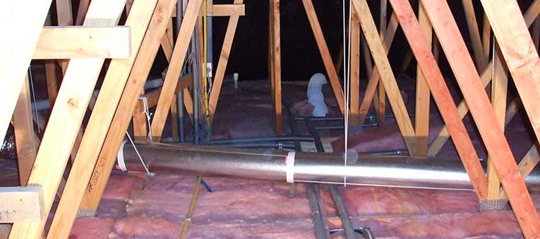 Home with insulation and a ventilation system installed in ceiling space